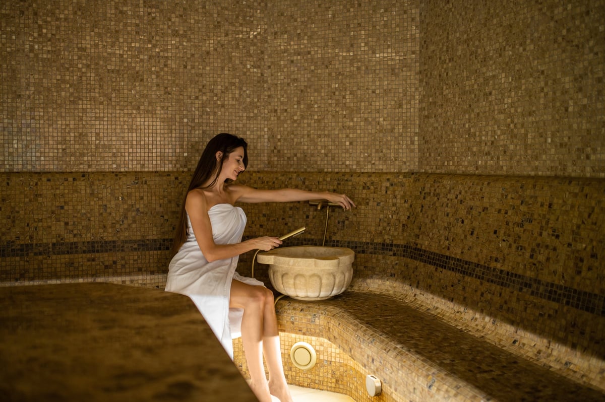 Woman relaxing and enjoying a hammam treatment