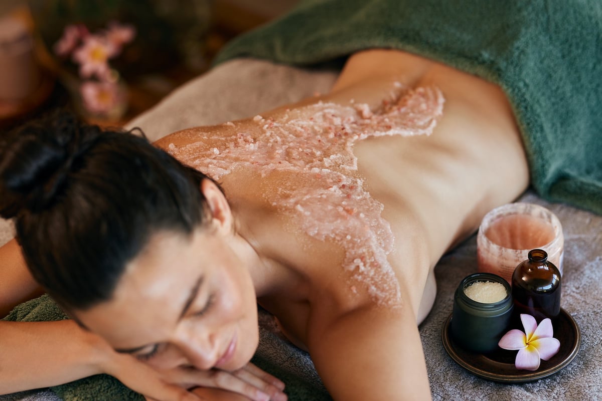 Woman relaxing on massage table during spa treatment